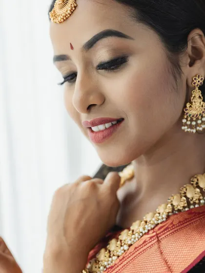 A beautiful close-up showcasing the delicate eye makeup and skin texture. This is the 'no filter' premium finish that I train my students to achieve on their clients.