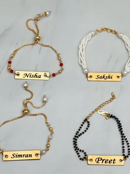 A collection of elegant name bracelets that can be used as rakhis. I offer different styles, including adjustable chains, beaded strands, and mangalsutra-style bracelets.