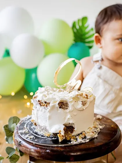 The aftermath of a successful cake smash. Sometimes the messiest photos are the most memorable, showing a birthday well celebrated.