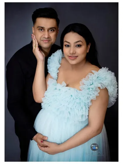 A tender pose during a couple's maternity session, highlighting the love and anticipation as they await their new arrival.