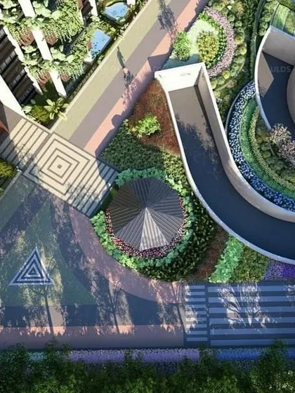 An aerial view of the 'Villa On Sky' project, showing how we integrate vehicle ramps and pathways with dense, multi-level planting to soften the infrastructure.