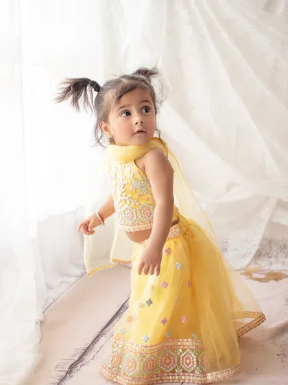 A little girl dressed in a beautiful yellow lehenga for her birthday photoshoot. I love incorporating traditional outfits into sessions.