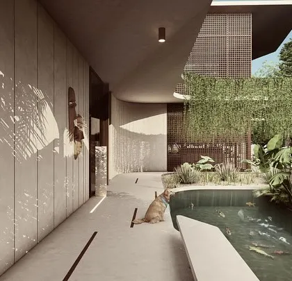 A long, curving corridor at the entrance of the House of Veils leads past a tranquil water body. This pathway is designed as a progressive reveal, slowly unveiling the home's interior courtyard and social spaces.
