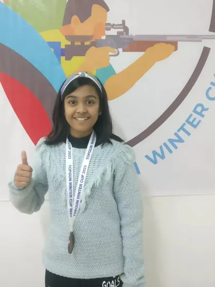 A thumbs-up for a job well done. One of our young medal winners at the TOPGUN WINTER CUP 2023, celebrating her achievement and ready for the next challenge.