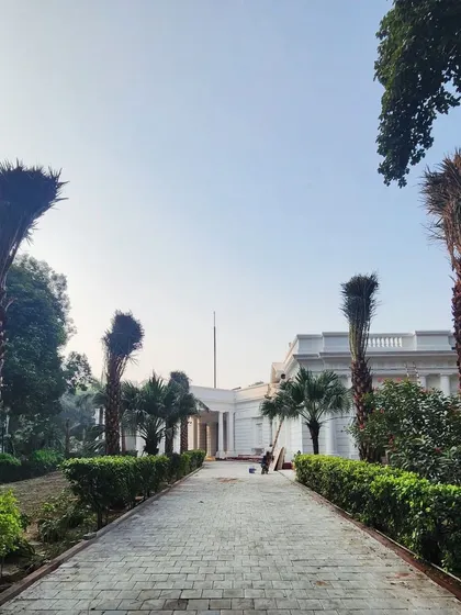 The long, stately driveway lined with our Date Palms and manicured hedges creates a powerful first impression for this property.