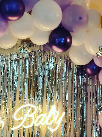 A top-down detail shot of the balloon arch, highlighting the different sizes and textures of balloons we use to create depth and interest.