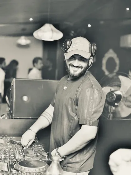 A classic black and white shot from behind the decks. I don't just play tracks; I play moods.