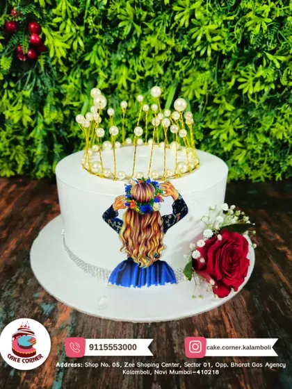A beautiful cake fit for a queen, decorated with a delicate pearl crown and a fresh red rose. Simple, elegant, and timeless.