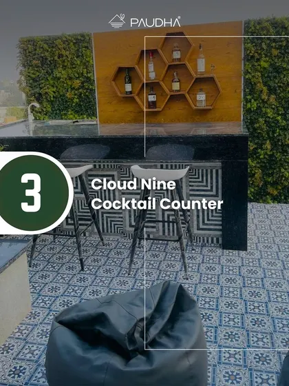 This is the "Cloud Nine Cocktail Counter" from one of my rooftop projects. Surrounded by vertical green walls and featuring a unique honeycomb shelf, it's the perfect spot for entertaining with style.