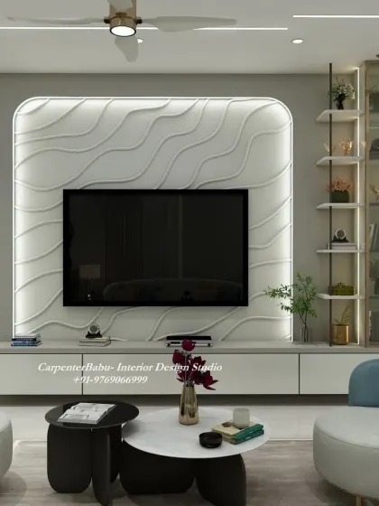 This TV unit features a unique wavy 3D panel, creating a sense of movement and artistry. The curved armchairs in blue add a soft, contrasting color to the room.