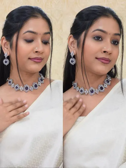 A stunning Victorian-style necklace with purple stones, paired with a simple off-white saree. This shows how contrast jewelry can make a statement.