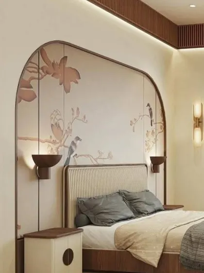 A custom-framed chinoiserie wallpaper with delicate birds and branches acts as a beautiful, art-like headboard, adding a touch of classic elegance.