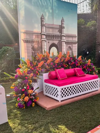 A photo spot with a backdrop of the Gateway of India. This, combined with the vibrant floral arrangements, brings the spirit of Mumbai to the celebration.