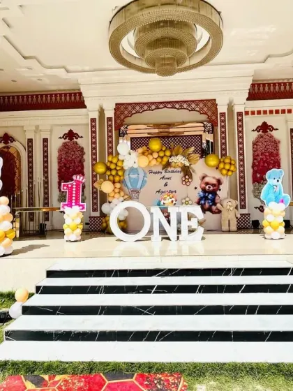 A wide shot of the impressive teddy bear themed stage setup in a large venue.