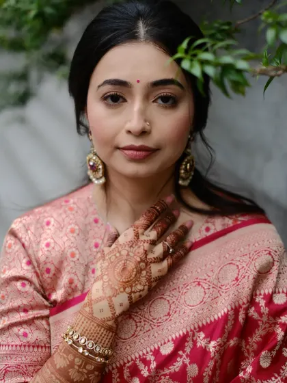 This portrait showcases the elegant stain of a jaali (net) pattern on the back of the hand. The color is deep and even, which is what I always aim for with my homemade henna paste.