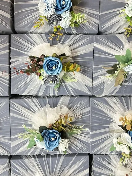 Another view of the corporate gift hampers, showcasing the consistency and attention to detail across the entire batch. Each floral topper is handcrafted to perfection.