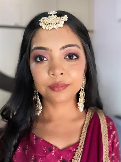 A close-up of this happy client, her eyes sparkling with the soft pink eyeshadow I used for her look.