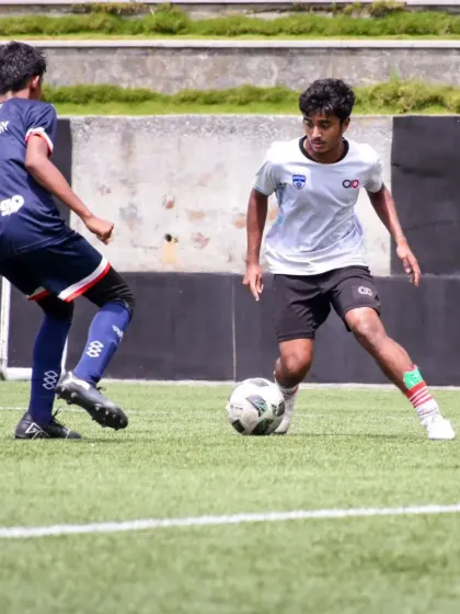 A one-on-one duel for the ball shows the competitive drills we use to sharpen our players' offensive and defensive skills.