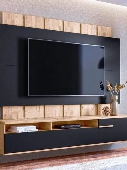A floating TV unit with a bold black and natural wood design. This wall-mounted style is great for creating a minimalist look.