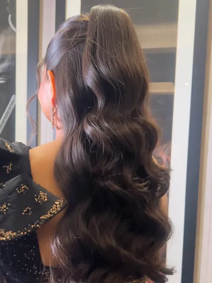 Another angle of the high ponytail, showing its length and the beautiful flow of the waves.