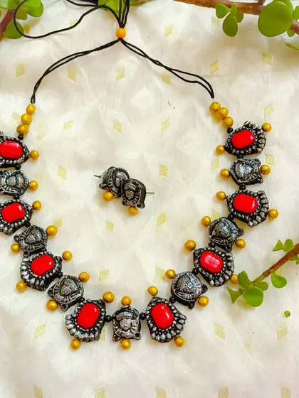 A duplicate image of the red and silver-oxide Durga choker, highlighting its availability.