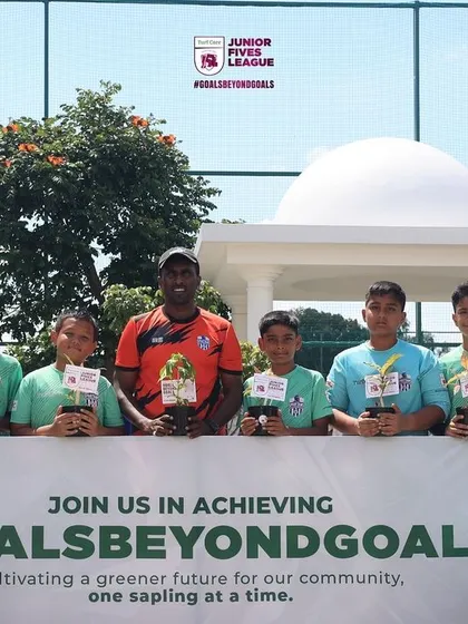 Players and coaches together for the #GoalsBeyondGoals photo, symbolizing our collective effort.