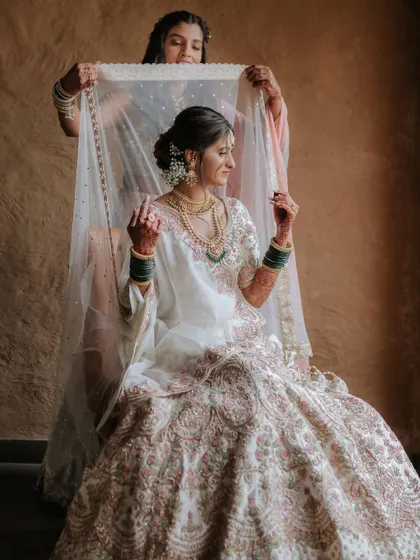 The final veil placement. A beautiful, traditional moment captured perfectly.