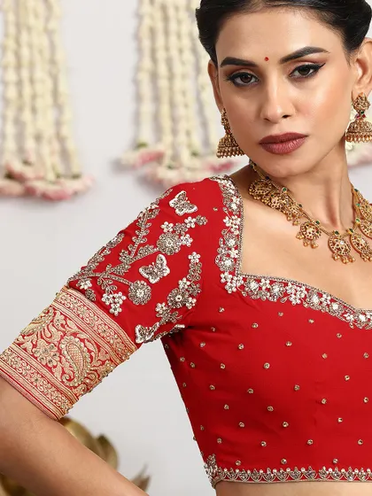 The beauty of our craft lies in the details. Here is a closer look at the exquisite hand-embroidery on a bridal blouse, where every sequin and thread is meticulously placed to create a work of art.