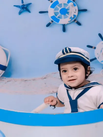 A close-up of our little sailor, ready to set sail in his boat.