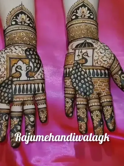 A beautiful Teej mehendi featuring peacocks inside a 'jharokha' (window). The details on the peacock feathers and the floral patterns on the fingers are very fine.