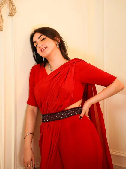 A modern take on the saree for Rakhi. This pre-draped red saree with a stylish belt from Akasa by Sanya is chic, comfortable, and festive.
