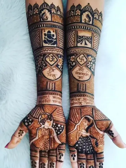 A design rich with symbolism. It includes bride and groom portraits, auspicious symbols like Om and Swastika, Ganesha, and written mantras for blessings.