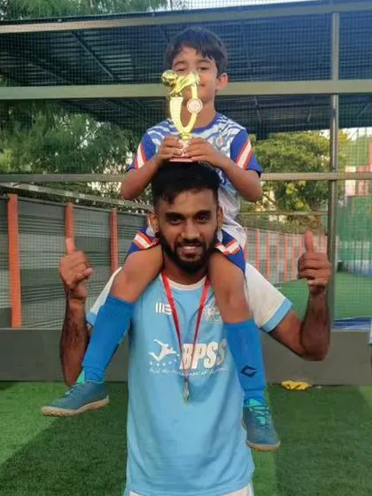 A player celebrating with a young supporter. This connection to the community is an important part of our club's identity.