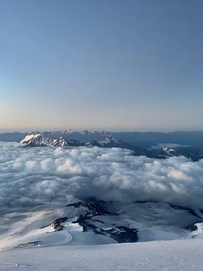 A view from the summit of Mt. Elbrus, Europe's highest peak. Looking down on a world blanketed by clouds is a humbling experience that reminds us why we climb.