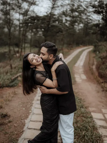 A happy, candid embrace during a pre-wedding shoot in a beautiful natural setting. I focus on capturing the genuine smiles and laughter that define your relationship.