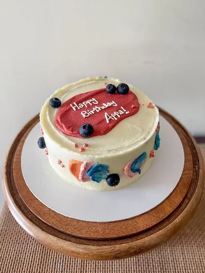 A simple and modern cake for Appa's birthday. This blueberry lemon curd cake is decorated with abstract buttercream swipes of color and fresh blueberries.