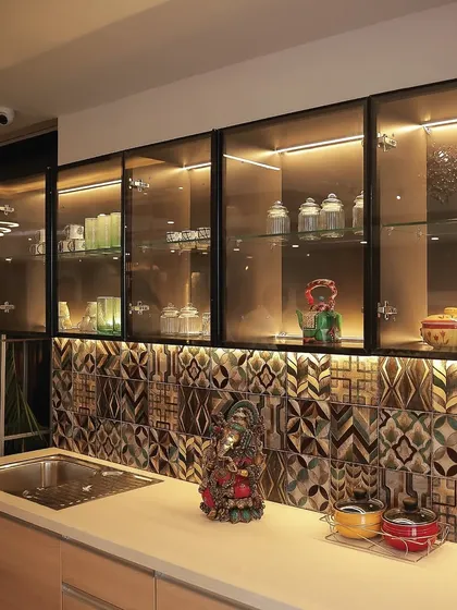 Another example of using horizontal space, this crockery unit with a patterned backsplash adds style and function to a compact dining area.