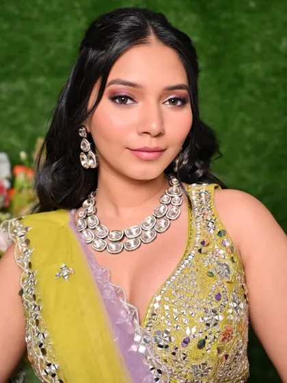 A close-up portrait focusing on the beautiful eye makeup and radiant skin for this Mehendi look.