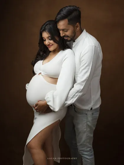 An intimate fine art maternity portrait of a couple. The focus is on their quiet connection and the shared joy of their journey, captured in a simple and elegant style.