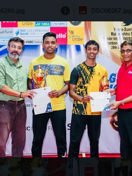 Presenting the award to the men's doubles winners. It is always an honor to recognize the next generation of badminton champions.