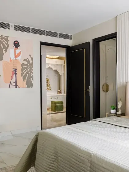 A beautifully appointed bedroom showcasing our signature style of quiet luxury. This space combines layered textures, a soothing color palette, and bespoke furniture to create a personal sanctuary for rest and relaxation.