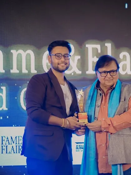 A student receives an award from Mr. Rakesh Bedi at the ceremony. Our programs provide opportunities for students to be recognized for their hard work in a real industry setting.