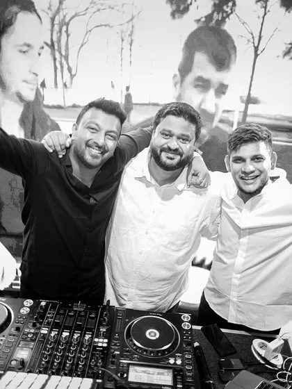 A great black and white photo with the DJ crew. We work together to create a dynamic and varied musical journey for the audience.