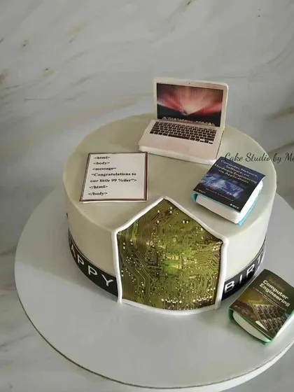 For a software programmer. This cake features a laptop, coding language, computer engineering books, and a cutaway showing a circuit board inside.