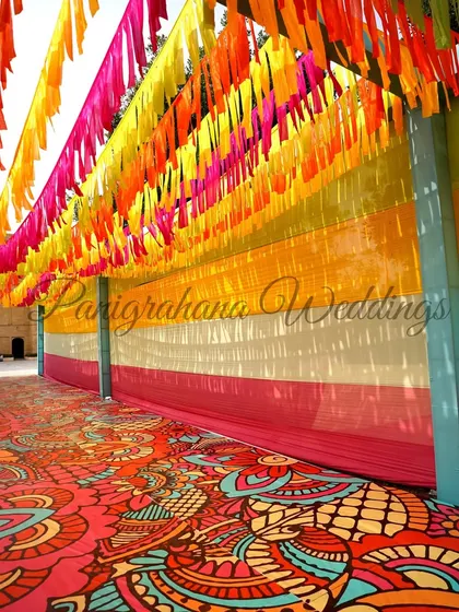 The vibrant, multi-colored entrance to a Rajasthani Mela themed event.