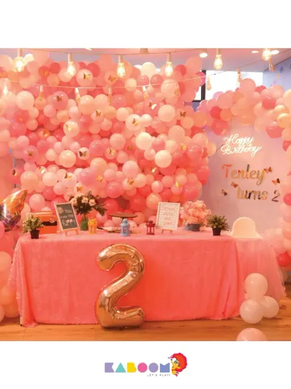 Another enchanting butterfly theme, this time for a second birthday. The wall of pink balloons creates a stunning and immersive photo backdrop.