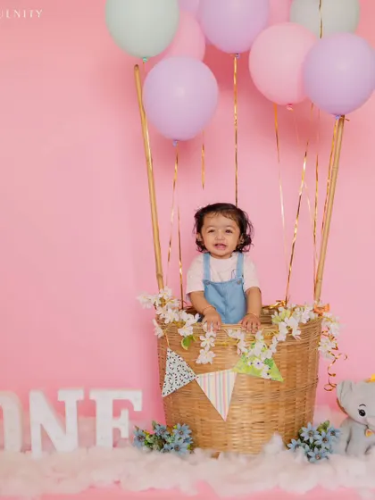 Another angle of this sweet girl's first birthday flight. Her happy expression shows how much fun themed shoots can be.