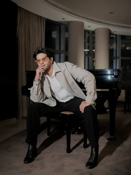 A thoughtful pose from Dulquer. This look is all about effortless elegance and modern sophistication.