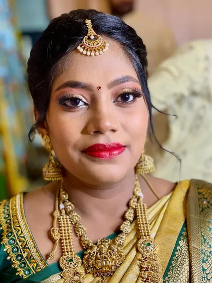 A close-up of the Seemantham makeup, showing the flawless base and bright, happy colors that celebrate this wonderful occasion.