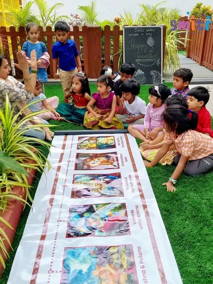 A teacher gestures as she tells a story, bringing the characters and events of Janmashtami to life for her students.
